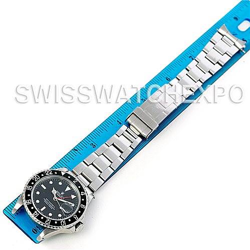 This image shows a Rolex Vintage Collection 16760 Stainless Steel Black Dial 16760 Stainless Steel Black Dial watch laid out flat beside a ruler, displaying the watch face and full metal bracelet.