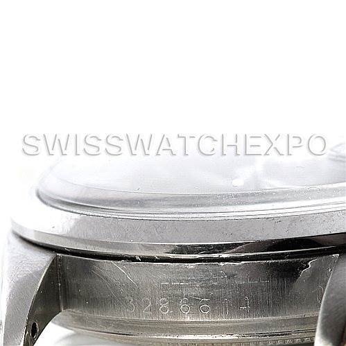 This image shows a close-up side view of a Rolex Vintage Collection 1601 Men's Stainless Steel Black Dial 1601 Men's Stainless Steel Black Dial watch, highlighting its case and part of the crystal.