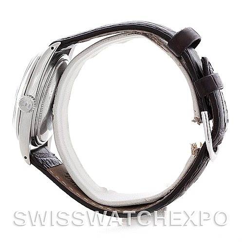 This image shows a side view of a Rolex Vintage Collection 1601 Men's Stainless Steel Black Dial 1601 Men's Stainless Steel Black Dial watch, highlighting the crown and leather strap.