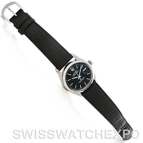 This image shows a bird's-eye view of a Rolex Vintage Collection 1601 Men's Stainless Steel Black Dial 1601 Men's Stainless Steel Black Dial watch with a black leather strap fully extended.