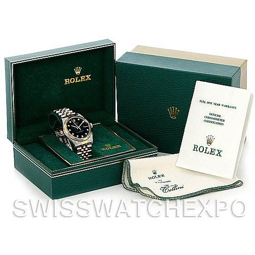 The image shows a Rolex Vintage Collection 16013 Men's Stainless Steel Black Dial 16013 Men's Stainless Steel Black Dial watch in its open green box, with accompanying packaging, a cloth, and a warranty booklet.