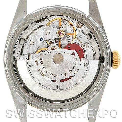 The image shows the back view of a Rolex Vintage Collection 16013 Men's Stainless Steel Black Dial 16013 Men's Stainless Steel Black Dial model, highlighting its intricate internal mechanical movements.