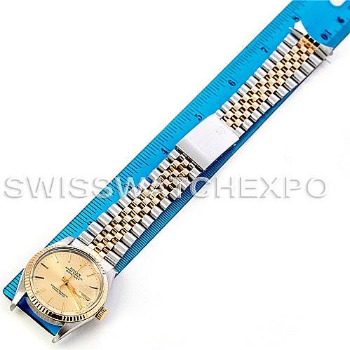 The Rolex Vintage Collection 16013 Men's Stainless Steel Champagne Dial 16013 Men's Stainless Steel Champagne Dial model watch is shown from a top-down angle, displaying the full band and face alongside a ruler for scale.