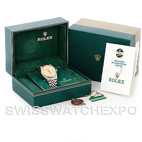 The Rolex Vintage Collection 16013 Men's Stainless Steel Champagne Dial 16013 Men's Stainless Steel Champagne Dial watch is displayed in its open green box with an instruction manual, tag, and outer box visible.