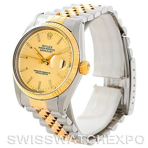 This image shows a side angle of a Rolex Vintage Collection 16013 Men's Stainless Steel Champagne Dial 16013 Men's Stainless Steel Champagne Dial Datejust watch, highlighting its gold dial, fluted bezel, and two-tone bracelet.