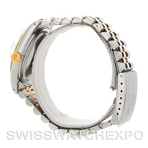 The image shows a side view of the Rolex Vintage Collection 16013 Men's Stainless Steel Champagne Dial 16013 Men's Stainless Steel Champagne Dial watch highlighting its casing and two-tone bracelet.