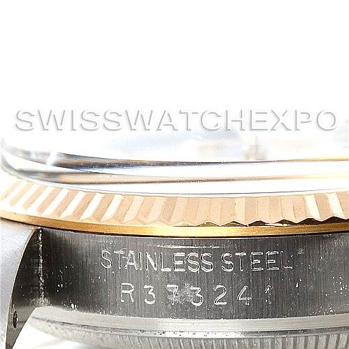 This image shows a close-up of the stainless steel case and bezel of a Rolex Vintage Collection 16013 Men's Stainless Steel White Dial 16013 Men's Stainless Steel White Dial watch, revealing its serial number.