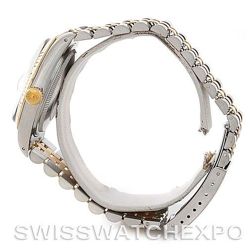 The image shows a side view of a Rolex Vintage Collection 16013 Men's Stainless Steel White Dial 16013 Men's Stainless Steel White Dial watch, highlighting the case, crown, and bracelet.