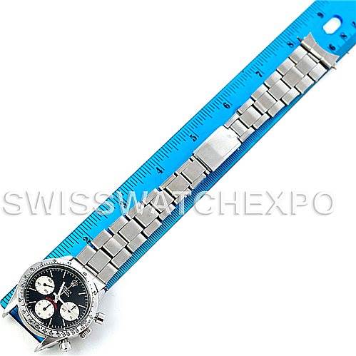 The image shows a top-down view of a Rolex Vintage Collection 6239 Men's Stainless Steel Black Dial 6239 Men's Stainless Steel Black Dial watch, including its dial, bezel, and metal bracelet alongside a ruler.