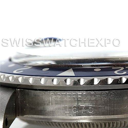 This image shows a close-up, side view of a Rolex Vintage Collection 1675 Men's Stainless Steel Black Dial 1675 Men's Stainless Steel Black Dial watch, highlighting the bezel and the "REGISTERED DESIGN 1675" engraving.