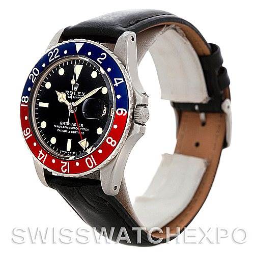The Vintage Collection model by Rolex is shown at a side angle, highlighting the bezel, dial, and black leather strap.
