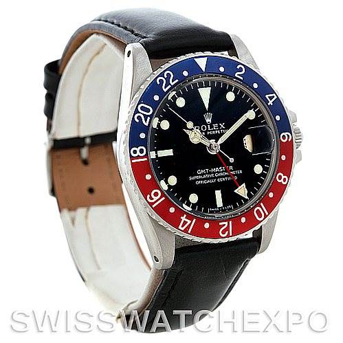 The image shows a side-angle view of a Rolex GMT-Master II Vintage Collection watch, featuring its bezel, dial, and leather strap.