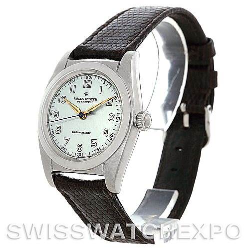 The image shows a Vintage Collection Rolex Oyster Perpetual watch, featuring a leather strap and a silver-tone bezel at a slight angle.