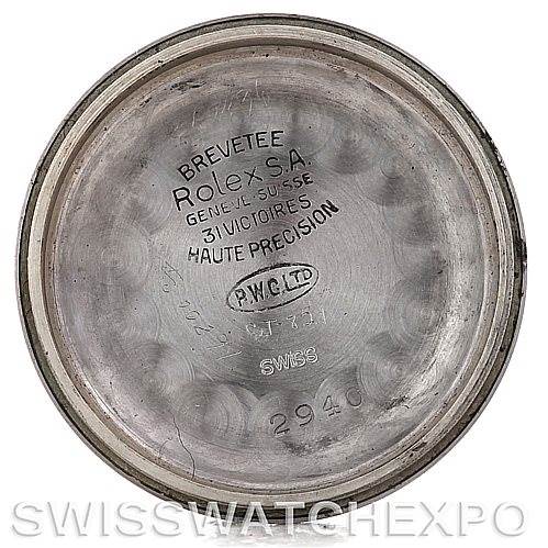 This image shows the inside case back of a Vintage Collection model by Rolex, displaying various engravings and markings.