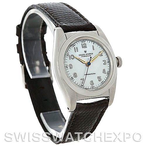 The image shows a Vintage Collection Rolex watch at a three-quarter view, displaying the face, bezel, and leather strap.