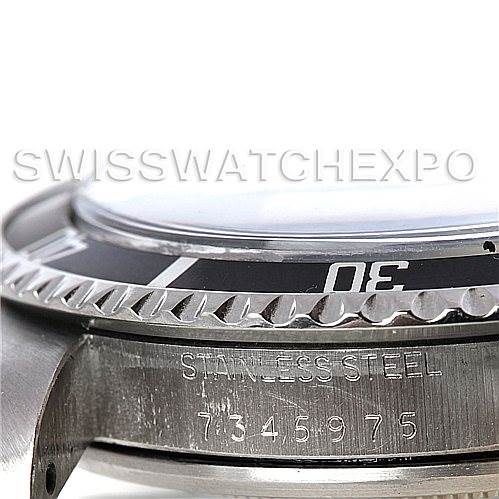 The image shows a close-up side angle of the bezel and case of a Rolex Vintage Collection 5513 Men's Stainless Steel Black Dial 5513 Men's Stainless Steel Black Dial watch, highlighting the "Stainless Steel" engraving.