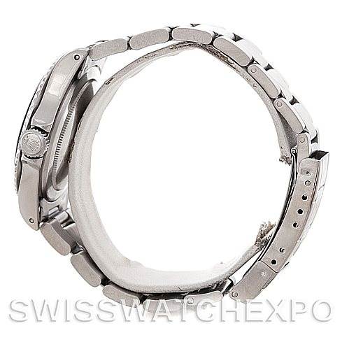 The image shows a side view of the Rolex Vintage Collection 5513 Men's Stainless Steel Black Dial 5513 Men's Stainless Steel Black Dial watch, highlighting its stainless steel bracelet and clasp.