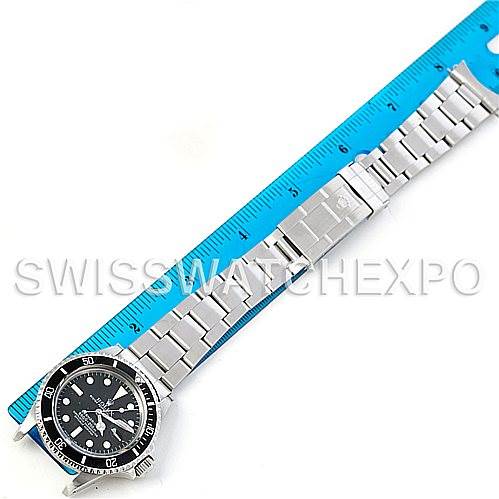 The image shows a top-down view of the Rolex Vintage Collection 1680 Men's Stainless Steel Black Dial 1680 Men's Stainless Steel Black Dial watch, focusing on its full bracelet and face next to a ruler for scale.