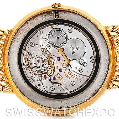 The image shows the rear view of the Rolex Vintage Collection 9577 Men's Yellow Gold Champagne Dial 9577 Men's Yellow Gold Champagne Dial watch, highlighting its intricate movement and internal mechanics.