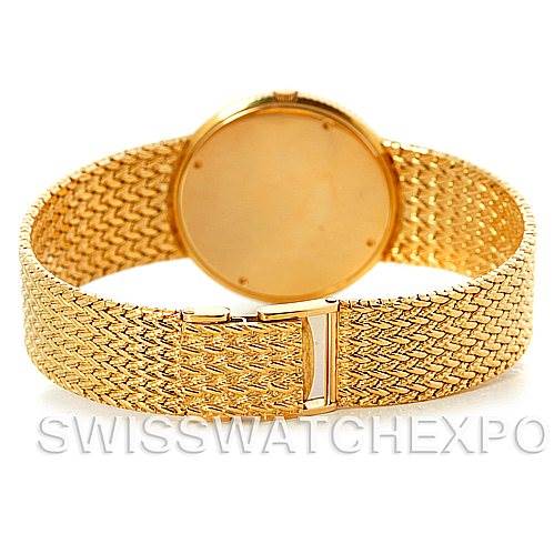 The image shows the back of the Vintage Collection watch by Rolex, highlighting the gold mesh bracelet and clasp.
