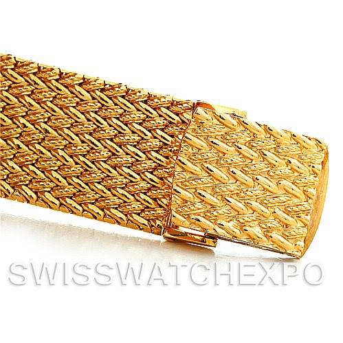 This image shows a close-up of a gold band detail from a Rolex Vintage Collection 9577 Men's Yellow Gold Champagne Dial 9577 Men's Yellow Gold Champagne Dial watch.