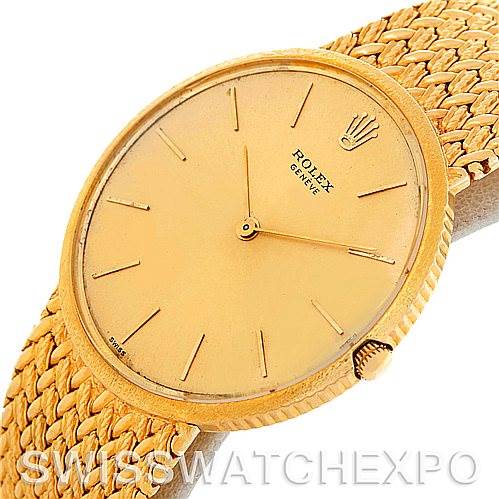 The image shows a Rolex Vintage Collection 9577 Men's Yellow Gold Champagne Dial 9577 Men's Yellow Gold Champagne Dial watch from an angled view, highlighting its gold dial, hour markers, and woven gold bracelet.