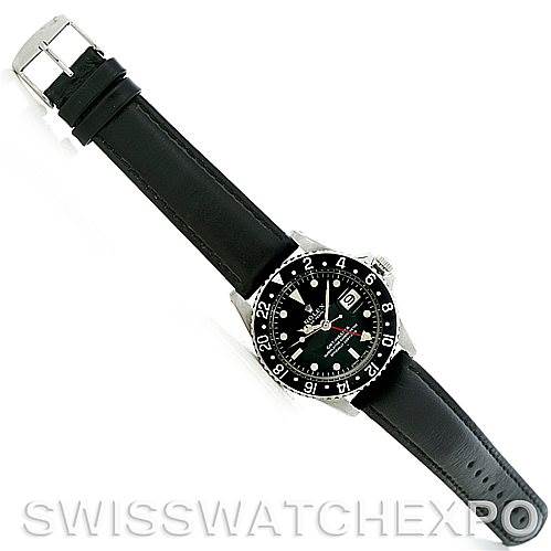 This image shows a top view of the Rolex Vintage Collection 1675 Men
s Stainless Steel Black Dial 1675 Men
s Stainless Steel Black Dial watch, featuring its black dial, bezel, and leather strap.