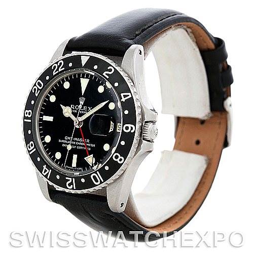 The image shows a side angle view of the Rolex Vintage Collection 1675 Men
s Stainless Steel Black Dial 1675 Men
s Stainless Steel Black Dial GMT-Master watch, highlighting the bezel, dial, and leather strap.