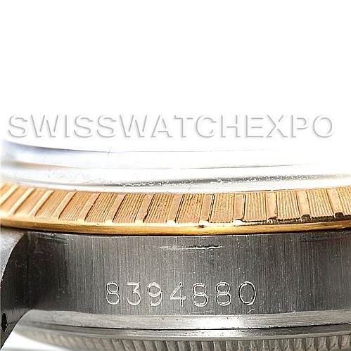 This image shows a close-up of the side of a Rolex Vintage Collection 15053 Men's Stainless Steel Silver Dial 15053 Men's Stainless Steel Silver Dial watch, highlighting the serial number and part of the bezel.