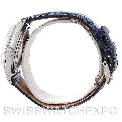 This image shows a side angle of the Rolex Vintage Collection 1603 Men's Stainless Steel Blue Dial 1603 Men's Stainless Steel Blue Dial watch, focusing on the case, crown, and leather strap with its buckle.