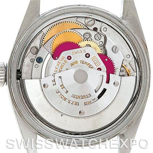 The image shows the back view of a Vintage Collection Rolex watch, highlighting its intricate internal mechanical parts.