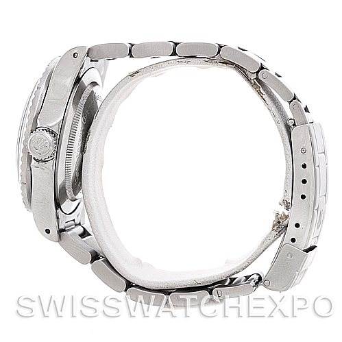 The image shows a side view of the Rolex Vintage Collection 1665 Men's Stainless Steel  1665 Men's Stainless Steel  watch, highlighting the crown, case, and bracelet.