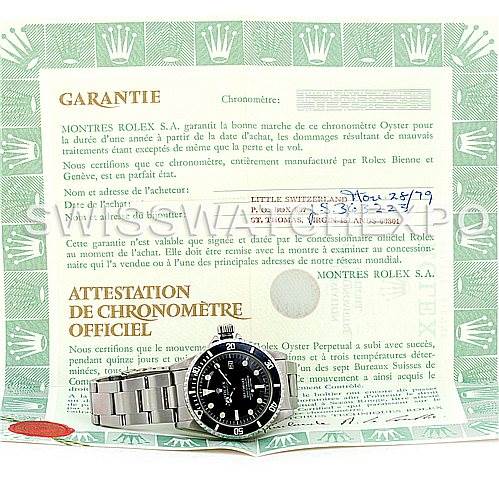 The image shows a Rolex Vintage Collection 1665 Men's Stainless Steel  1665 Men's Stainless Steel  watch with a stainless steel bracelet, placed in front of its warranty and chronometer certification documents.