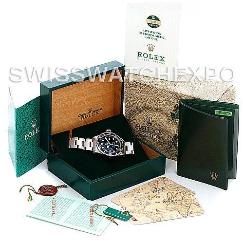 This image shows a Rolex Vintage Collection 1665 Men's Stainless Steel  1665 Men's Stainless Steel  watch in its box, along with various accessories and documents around it.