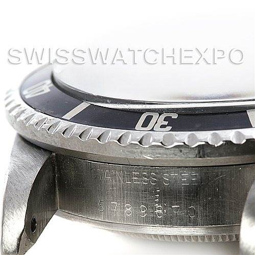 This image shows a close-up side angle of a Rolex Vintage Collection 1665 Men's Stainless Steel  1665 Men's Stainless Steel  watch, highlighting the bezel and watch case details.