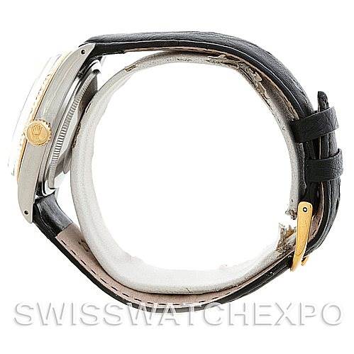 Side view of the Rolex Vintage Collection 16013 Men's Stainless Steel Champagne Dial 16013 Men's Stainless Steel Champagne Dial watch showing its black leather strap, gold crown, and part of the metal case.