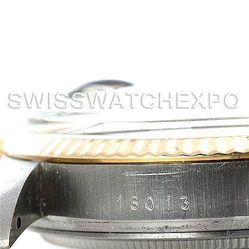This image shows a close-up of the side view of a Rolex Vintage Collection 16013 Men's Stainless Steel Champagne Dial 16013 Men's Stainless Steel Champagne Dial watch, highlighting the fluted bezel and model number engraving.