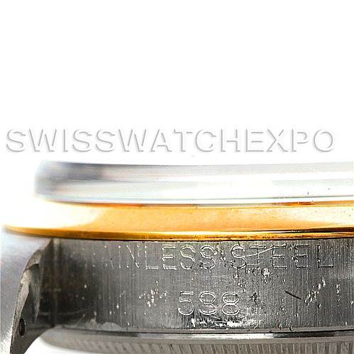 This image shows a side view of a Rolex Vintage Collection 1002 Men's Steel and Gold (two tone) Silver Dial 1002 Men's Steel and Gold (two tone) Silver Dial watch, focusing on the stainless steel and gold bezel with engraved details.