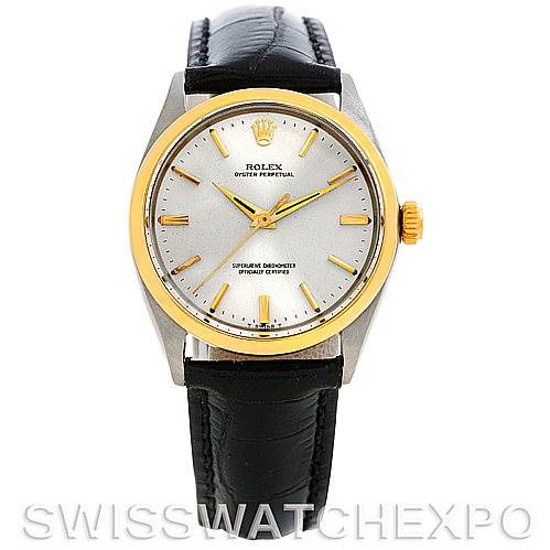The image shows a front view of a Rolex Vintage Collection 1002 Men's Steel and Gold (two tone) Silver Dial 1002 Men's Steel and Gold (two tone) Silver Dial watch with a gold bezel and a black leather strap.