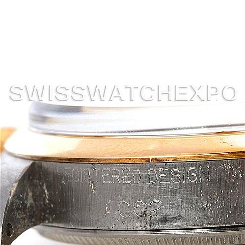 This close-up image shows the side of the case and bezel of a Vintage Collection Rolex watch with "REGISTERED DESIGN" engraving.