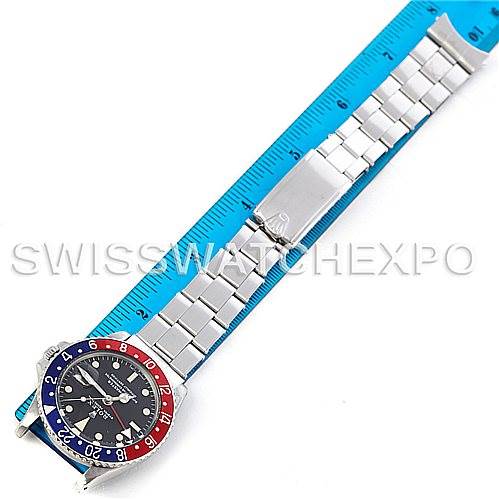 The image shows a Rolex Vintage Collection 1675 Men's Stainless Steel Black Dial 1675 Men's Stainless Steel Black Dial watch in a flat, top-down view with a metal bracelet and a blue and red bezel.