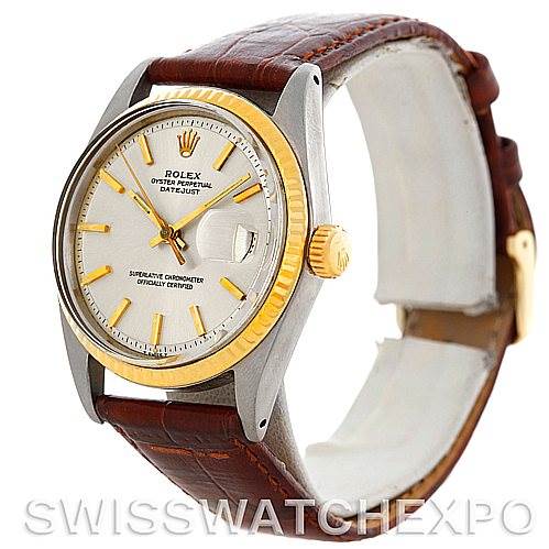 The image shows a side angle of the Rolex Vintage Collection 1601 Men's Stainless Steel Silver Dial 1601 Men's Stainless Steel Silver Dial watch, highlighting its dial, bezel, crown, and leather strap.