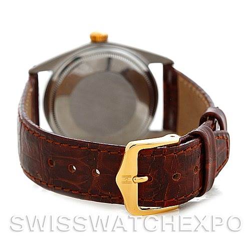 The image shows the back of the Rolex Vintage Collection 1601 Men's Stainless Steel Silver Dial 1601 Men's Stainless Steel Silver Dial model watch, focusing on the caseback and leather strap with a buckle.