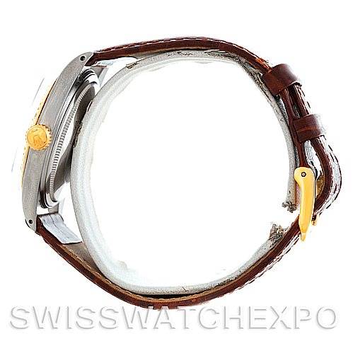The image shows the side view of a Vintage Collection Rolex watch with a brown leather strap and gold crown.