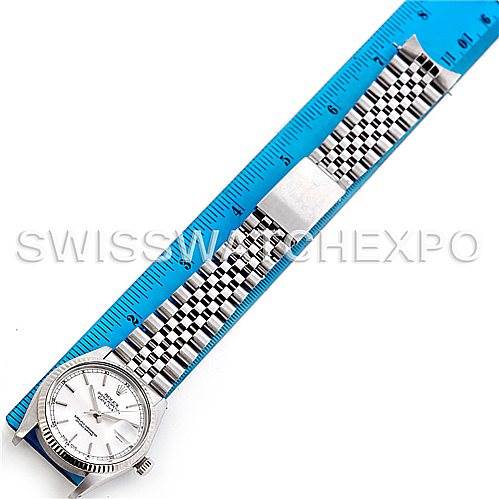 This image shows a Rolex Vintage Collection 16014 Men's Stainless Steel Silver Dial 16014 Men's Stainless Steel Silver Dial watch laid flat alongside a blue ruler, displaying the dial and bracelet.