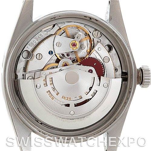 The image shows the back view of a Rolex Vintage Collection 16014 Men's Stainless Steel Silver Dial 16014 Men's Stainless Steel Silver Dial watch, focusing on its intricate movement mechanism.