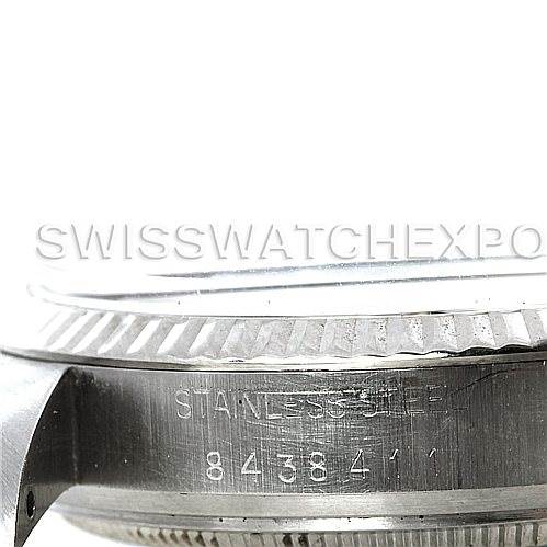 The image shows a close-up of the side of the Rolex Vintage Collection 16014 Men's Stainless Steel Silver Dial 16014 Men's Stainless Steel Silver Dial watch case, specifically the bezel and the engraved serial number.