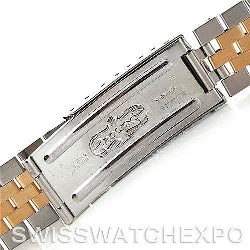 This image shows the clasp and part of the band of a Vintage Collection model by Rolex, featuring the brand's engraving.