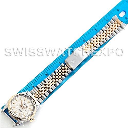 The image shows a Rolex Vintage Collection 16013 Men's Stainless Steel Silver Dial 16013 Men's Stainless Steel Silver Dial watch with a Jubilee bracelet laid flat, alongside a blue ruler for measurement.