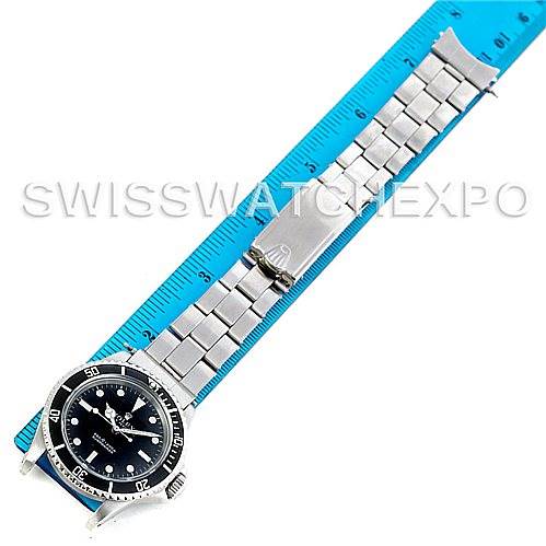 The Rolex Vintage Collection 5513 Men
s Stainless Steel Black Dial 5513 Men
s Stainless Steel Black Dial model watch is shown flat with its bracelet fully extended and measured against a blue ruler.